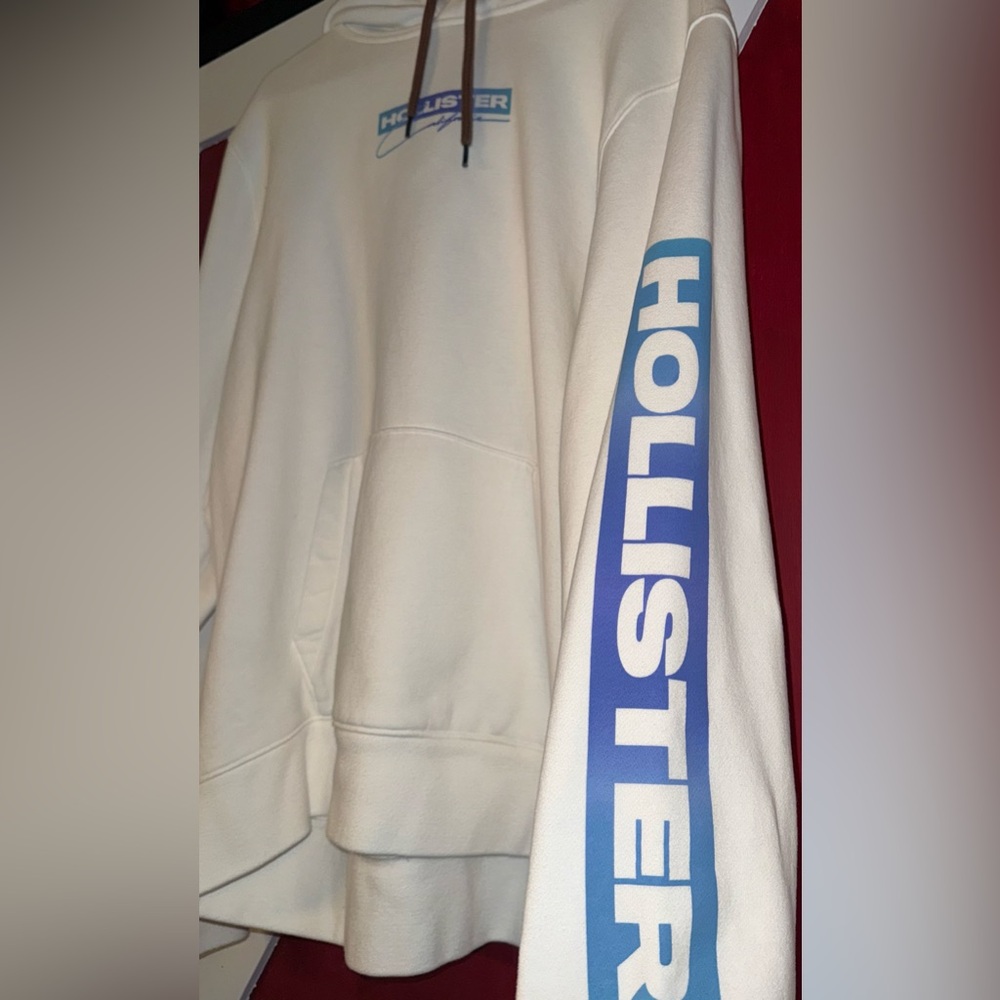 Vintage XXL Hollister California Cream Hoodie with Blue Sleeve Logo